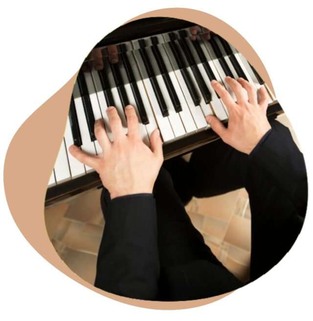 Two hands playing a scale on piano keys, seen from above