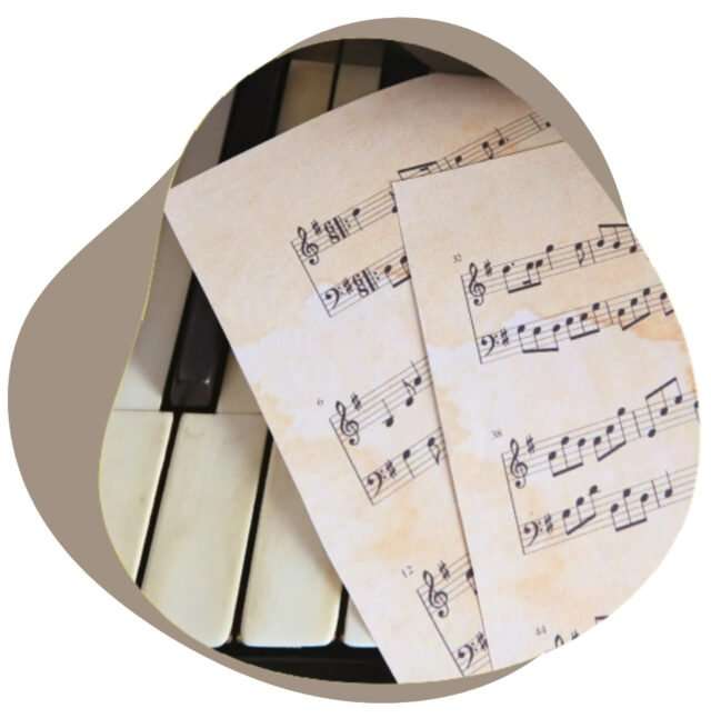 Sheets of piano music lying on the keyboard
